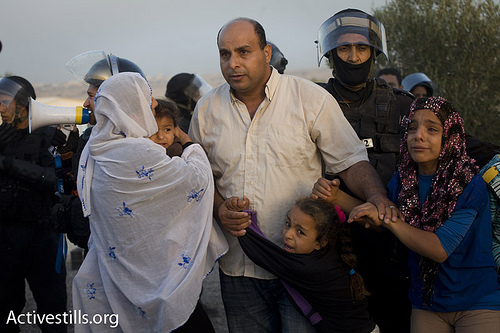 After the youth clear out the homes, the police move in...